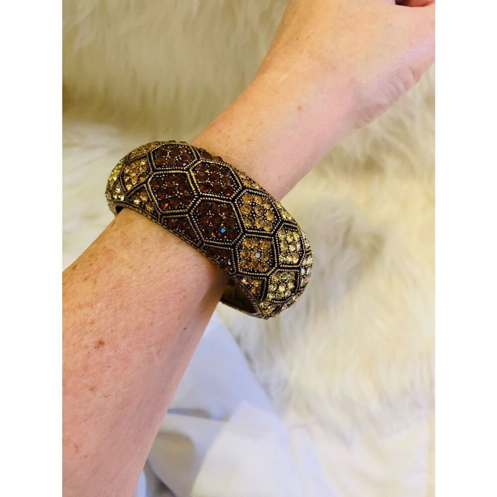 Cuff bracelet with a honeycomb pattern and amber-colored rhinestones